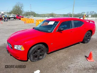 2009 Dodge Charger SXT with VIN 2B3KA33V49H639426, listed as a IAAI auction lot 42041134 with 155,410 mi miles and . Bid and sale history available at carsss.com. Image 2.