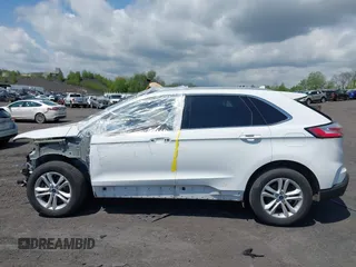2020 Ford Edge SEL z VIN 2FMPK4J95LBA31157, wystawiony jako IAAI lot #42225863 z przebiegiem 96 082 mil mil oraz . Historia ofert i sprzedaży dostępna na DreamBid. Obrazek 14.