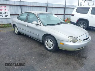 1997 Ford Taurus GL z VIN 1FALP52UXVG180596, wystawiony jako IAAI lot #42463461 z przebiegiem 190 419 mil mil oraz . Historia ofert i sprzedaży dostępna na DreamBid. Obrazek 1.