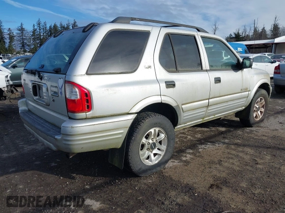 2002 Isuzu Rodeo z VIN 4S2DM58W924321403, wystawiony jako IAAI lot #41503572 z przebiegiem 235 072 mil mil oraz . Historia ofert i sprzedaży dostępna na DreamBid. Obrazek 4.