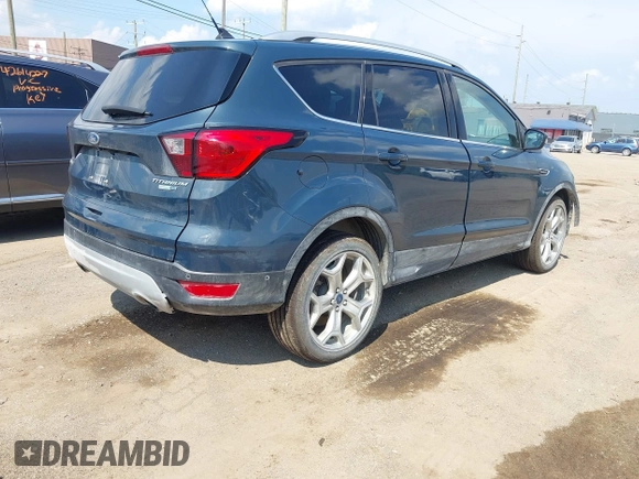 2019 Ford Escape Titanium with VIN 1FMCU9J99KUC00935, listed as a IAAI auction lot 42583250 with 91,241 mi miles and . Bid and sale history available at DreamBid. Image 4.