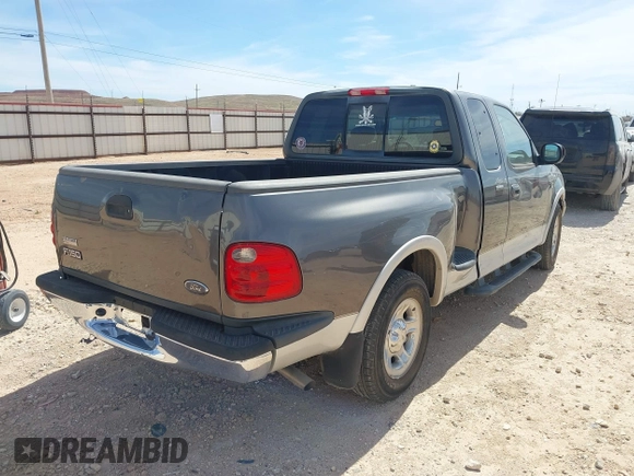 2002 Ford F-150 XL with VIN 1FTRX07L92KC81256, listed as a IAAI auction lot 41765831 with 149,506 mi miles. Bid and sale history available at carsss.com. Image 4.