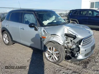 2012 MINI Countryman with VIN WMWZB3C59CWM05749, listed as a IAAI auction lot 38329304 with 64,590 mi miles and . Bid and sale history available at DreamBid. Image 1.