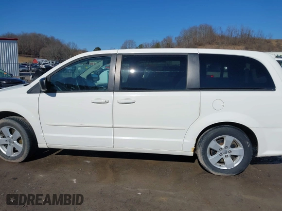 2013 Dodge Grand Caravan SE with VIN 2C4RDGBG0DR760598, listed as a IAAI auction lot 41590428 with 182,847 mi miles and . Bid and sale history available at DreamBid. Image 14.