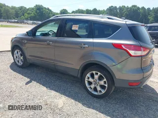 2014 Ford Escape Titanium z VIN 1FMCU0JX3EUA26519, wystawiony jako IAAI lot #42553081 z przebiegiem 108 052 mil mil oraz . Historia ofert i sprzedaży dostępna na DreamBid. Obrazek 3.