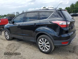2017 Ford Escape Titanium with VIN 1FMCU9J9XHUD30408, listed as a Copart auction lot 58393844 with 81,779 mi miles and Salvage Title. Bid and sale history available at carsss.com. Image 2.