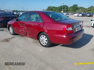 2004 Toyota Camry LE with VIN 4T1BE32KX4U272768, listed as a IAAI auction lot 42006421 with 204,386 mi miles. Bid and sale history available at carsss.com. Image 3.