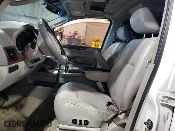 2010 Nissan Armada Titanium z VIN 5N1BA0NDXAN610604, wystawiony jako Copart lot #80023374 z przebiegiem 199 475 mil mil oraz Szkoda całkowita • Salvage title. Historia ofert i sprzedaży dostępna na DreamBid. Obrazek 7.