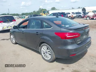2017 Ford Focus Titanium with VIN 1FADP3J27HL306546, listed as a IAAI auction lot 42480576 with 114,285 mi miles and . Bid and sale history available at DreamBid. Image 3.