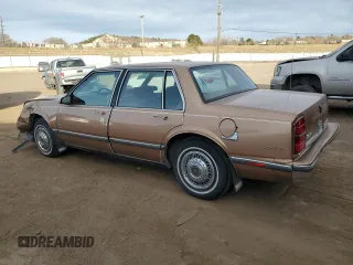 1989 Oldsmobile Delta z VIN 1G3HN54C2KW373577, wystawiony jako Copart lot #41532245 z przebiegiem 78 364 mil mil oraz Tytuł czysty. Historia ofert i sprzedaży dostępna na DreamBid. Obrazek 2.