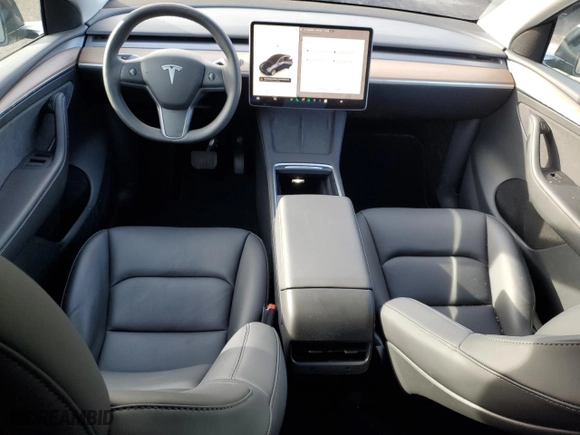 2024 Tesla Model Y with VIN 7SAYGDED1RF016792, listed as a Copart auction lot 50057345 with 6,749 mi miles and Salvage Title. Bid and sale history available at carsss.com. Image 8.