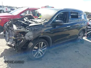 2016 Honda Pilot Elite with VIN 5FNYF6H0XGB127133, listed as a IAAI auction lot 41723875 with Not Provided miles. Bid and sale history available at carsss.com. Image 2.