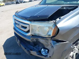 2011 Honda Pilot Touring with VIN 5FNYF4H95BB090892, listed as a IAAI auction lot 41878404 with 131,757 mi miles. Bid and sale history available at carsss.com. Image 6.