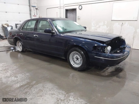2000 Ford Crown Victoria with VIN 2FAFP73W1YX129365, listed as a IAAI auction lot 41865917 with 102,957 mi miles. Bid and sale history available at carsss.com. Image 1.