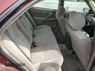 1999 Toyota Camry LE z VIN JT2BF22K8X0181675, wystawiony jako Copart lot #55057875 z przebiegiem 184 657 mil mil oraz Szkoda całkowita • Salvage title. Historia ofert i sprzedaży dostępna na DreamBid. Obrazek 10.