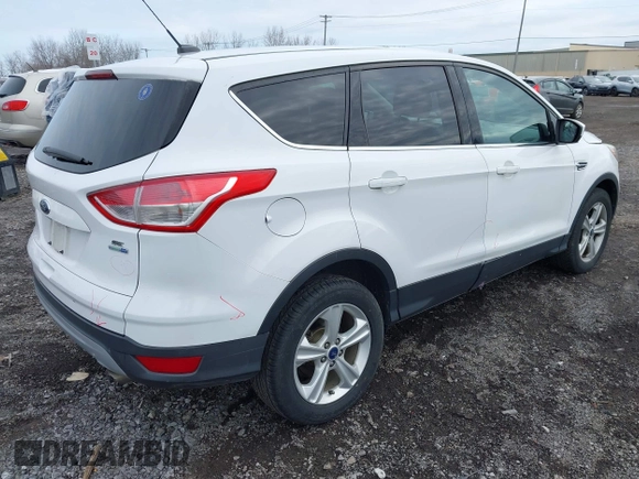 2014 Ford Escape SE z VIN 1FMCU9GX6EUE32418, wystawiony jako IAAI lot #42022304 z przebiegiem 100 216 mil mil oraz . Historia ofert i sprzedaży dostępna na DreamBid. Obrazek 4.