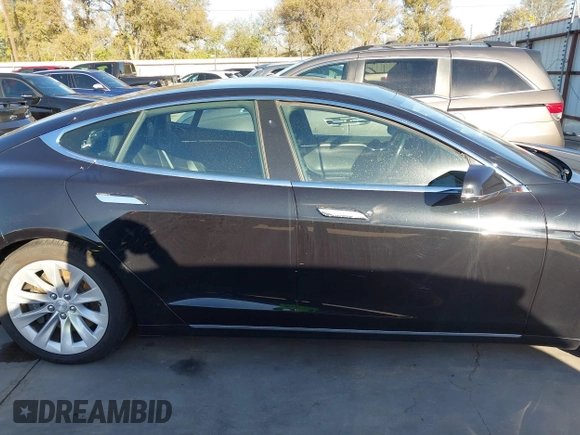 2017 Tesla Model S 60 with VIN 5YJSA1E19HF226094, listed as a IAAI auction lot 40931307 with 80,392 mi miles and . Bid and sale history available at DreamBid. Image 14.
