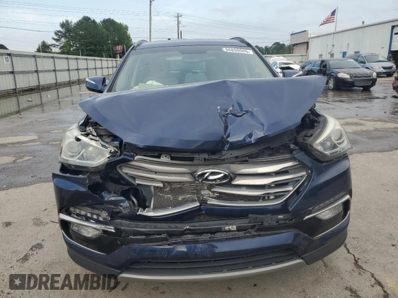 2018 Hyundai Santa Fe 2.4L z VIN 5XYZU3LB2JG537457, wystawiony jako Copart lot #56800005 z przebiegiem 97 344 mil mil oraz Szkoda całkowita • Salvage title. Historia ofert i sprzedaży dostępna na DreamBid. Obrazek 5.