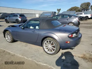 2006 Mazda MX-5 Miata Sport z VIN JM1NC25F260115830, wystawiony jako Copart lot #76844774 z przebiegiem 52 599 mil mil oraz Szkoda całkowita • Salvage title. Historia ofert i sprzedaży dostępna na DreamBid. Obrazek 2.
