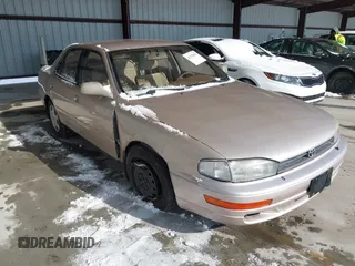 1994 Toyota Camry LE z VIN 4T1GK12E2RU002762, wystawiony jako IAAI lot #41376893 z przebiegiem 100 375 mil mil oraz . Historia ofert i sprzedaży dostępna na DreamBid. Obrazek 1.