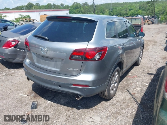 2015 Mazda CX-9 Touring with VIN JM3TB2CA2F0451180, listed as a IAAI auction lot 42180078 with 112,804 mi miles and . Bid and sale history available at carsss.com. Image 4.