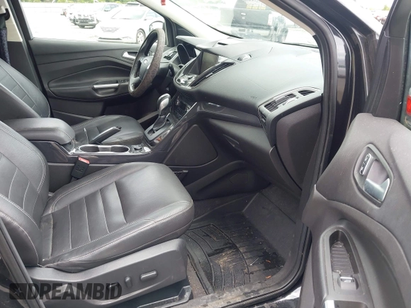 2015 Ford Escape Titanium с VIN 1FMCU0JXXFUB10676, выставлен на аукционе IAAI как лот 42412073 с пробегом 129 737 миль миль и . История ставок и продаж доступна на DreamBid. Изображение 5.