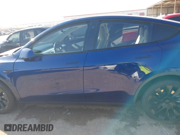 2021 Tesla Model Y Standard Range with VIN 5YJYGDED5MF121874, listed as a IAAI auction lot 41238170 with 72,041 mi miles and . Bid and sale history available at DreamBid. Image 14.