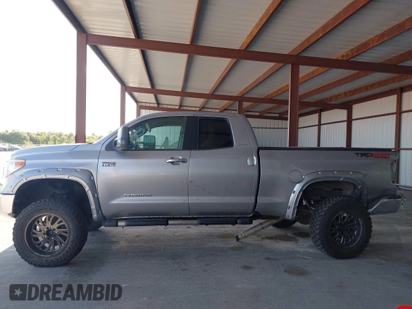 2015 Toyota Tundra Limited with VIN 5TFBW5F14FX424723, listed as a IAAI auction lot 42129929 with 222,060 mi miles and . Bid and sale history available at DreamBid. Image 14.