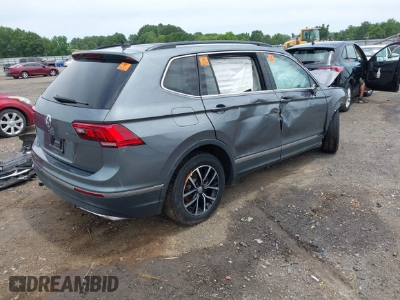 2021 Volkswagen Tiguan SE z VIN 3VV3B7AX8MM159316, wystawiony jako IAAI lot #42525546 z przebiegiem 70 141 mil mil oraz . Historia ofert i sprzedaży dostępna na DreamBid. Obrazek 4.