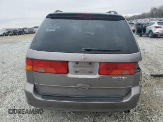 2000 Honda Odyssey EX with VIN 2HKRL1865YH513885, listed as a Copart auction lot 50223505 with 214,627 mi miles and Salvage Title. Bid and sale history available at DreamBid. Image 6.