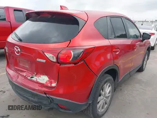 2015 Mazda CX-5 Touring with VIN JM3KE4CYXF0439953, listed as a IAAI auction lot 42124197 with 242,614 mi miles and . Bid and sale history available at DreamBid. Image 4.
