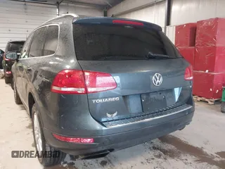 2013 Volkswagen Touareg Lux with VIN WVGEF9BP6DD007032, listed as a IAAI auction lot 41684721 with 147,249 mi miles and . Bid and sale history available at DreamBid. Image 3.