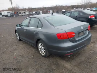 2014 Volkswagen Jetta Sedan SE w/Connectivity with VIN 3VWD17AJ2EM217534, listed as a IAAI auction lot 41872938 with 99,764 mi miles. Bid and sale history available at carsss.com. Image 3.