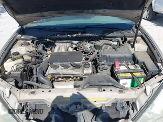 2002 Toyota Camry XLE z VIN 4T1BF30K82U018974, wystawiony jako IAAI lot #41712857 z przebiegiem 236 353 mil mil oraz . Historia ofert i sprzedaży dostępna na DreamBid. Obrazek 10.