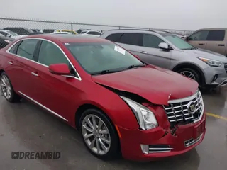 2013 Cadillac XTS Luxury with VIN 2G61P5S32D9115640, listed as a IAAI auction lot 41065284 with 125,643 mi miles and . Bid and sale history available at carsss.com. Image 1.