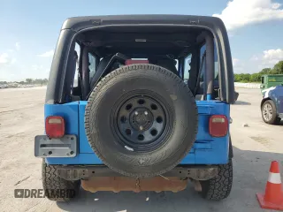 2002 Jeep Wrangler X with VIN 1J4FA39S92P776435, listed as a Copart auction lot 62792235 with 182,385 mi miles and Salvage title. Bid and sale history available at DreamBid. Image 6.