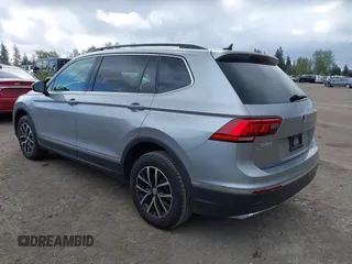 2021 Volkswagen Tiguan SE with VIN 3VV3B7AX0MM008809, listed as a IAAI auction lot 42077986 with 70,780 mi miles and . Bid and sale history available at DreamBid. Image 3.