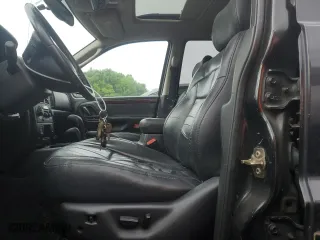 2003 Jeep Grand Cherokee Limited with VIN 1J4GW58N73C569810, listed as a Copart auction lot 57643474 with 123,294 mi miles and Clean Title. Bid and sale history available at carsss.com. Image 7.