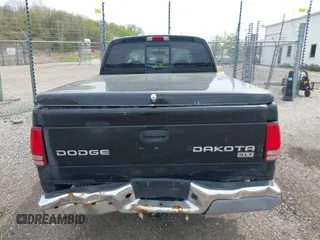 2004 Dodge Dakota SLT z VIN 1D7HG48N54S664848, wystawiony jako IAAI lot #42152635 z przebiegiem 153 824 mil mil oraz . Historia ofert i sprzedaży dostępna na DreamBid. Obrazek 16.