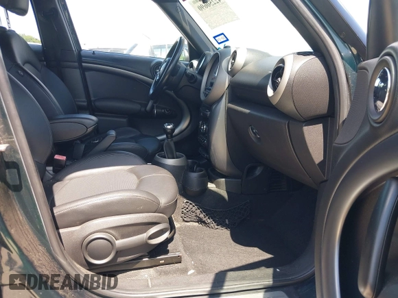 2011 MINI Countryman S with VIN WMWZC5C53BWM10484, listed as a IAAI auction lot 42250690 with 113,534 mi miles and . Bid and sale history available at DreamBid. Image 5.