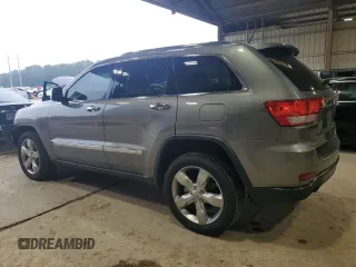 2013 Jeep Grand Cherokee Overland with VIN 1C4RJECT6DC526032, listed as a Copart auction lot 55660905 with 97,406 mi miles and Salvage Title. Bid and sale history available at DreamBid. Image 2.