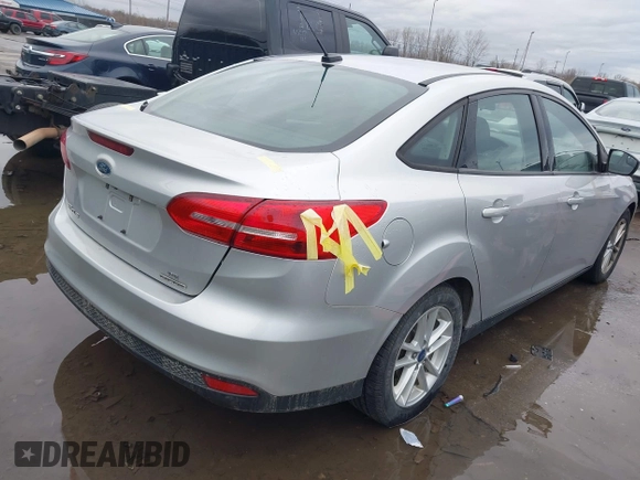 2016 Ford Focus SE with VIN 1FADP3F28GL386303, listed as a IAAI auction lot 41905397 with 158,112 mi miles. Bid and sale history available at carsss.com. Image 4.