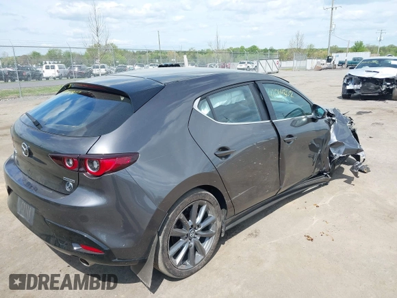 2023 Mazda 3 S Select with VIN JM1BPAKM3P1615785, listed as a IAAI auction lot 42064302 with 63,928 mi miles and . Bid and sale history available at DreamBid. Image 4.