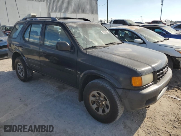 1999 Isuzu Rodeo S with VIN 4S2CK58W7X4357230, listed as a Copart auction lot 85214894 with 130,370 mi miles and Salvage title. Bid and sale history available at DreamBid. Image 4.