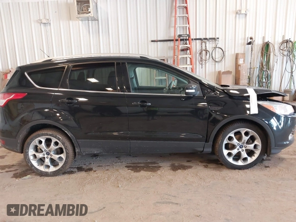 2016 Ford Escape Titanium with VIN 1FMCU0JX3GUB70607, listed as a IAAI auction lot 41727421 with 106,857 mi miles. Bid and sale history available at carsss.com. Image 14.