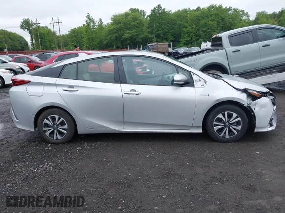 2017 Toyota Prius Plus z VIN JTDKARFPXH3034892, wystawiony jako IAAI lot #42376800 z przebiegiem 65 548 mil mil oraz . Historia ofert i sprzedaży dostępna na DreamBid. Obrazek 13.