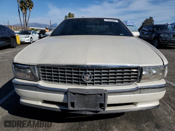 1995 Cadillac Concours z VIN 1G6KF52Y0SU301356, wystawiony jako Copart lot #77372694 z przebiegiem 132 934 mil mil oraz Szkody całkowita. Historia ofert i sprzedaży dostępna na DreamBid. Obrazek 5.