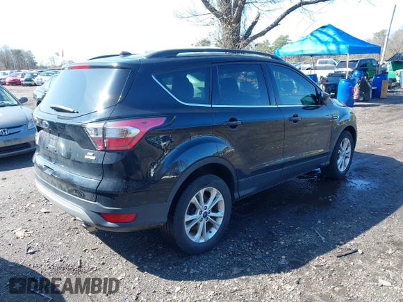 2018 Ford Escape SE with VIN 1FMCU0GD2JUA65979, listed as a IAAI auction lot 41894516 with 145,424 mi miles. Bid and sale history available at carsss.com. Image 4.