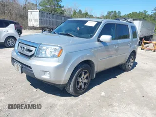 2011 Honda Pilot Touring with VIN 5FNYF4H91BB086712, listed as a IAAI auction lot 41809369 with 260,718 mi miles. Bid and sale history available at carsss.com. Image 2.
