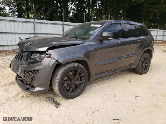 2015 Jeep Grand Cherokee SRT with VIN 1C4RJFDJ9FC842448, listed as a Copart auction lot 56956284 with 178,141 mi miles and Salvage Title. Bid and sale history available at carsss.com. Image 1.